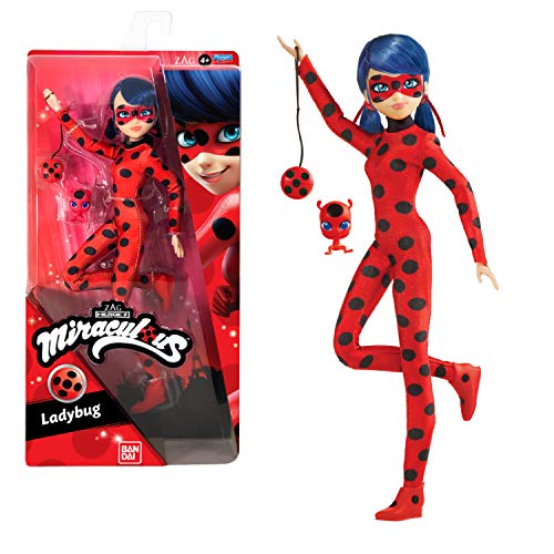 A red and black spotted figure of Miraculous Ladybug, featuring blue hair and a mask, stands beside a small ladybug plush toy, all in a colorful packaging.