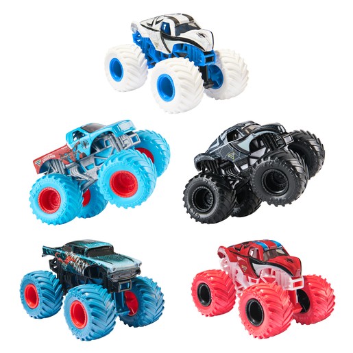 Five colorful monster truck toys featuring bold designs: a black and white truck, a blue and red truck, a black truck with blue wheels, a red truck, and a blue truck with unique graphics.