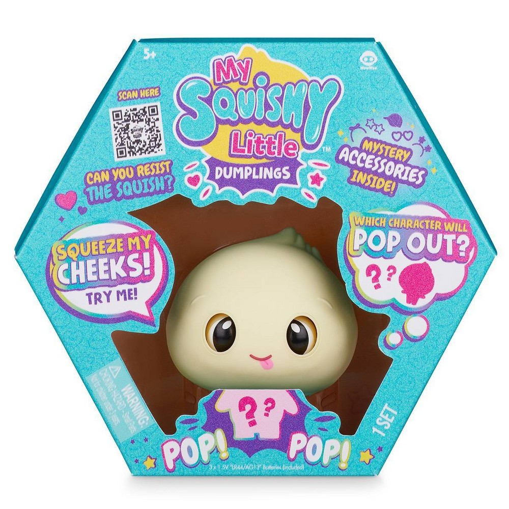 Interactive toy featuring a blue doe character with a soft, squishy texture, packaged in a colorful hexagonal box with playful graphics and mystery accessories.