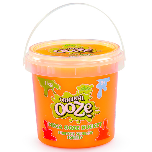 Bright orange plastic bucket labeled "Original Ooze" with a clear lid, featuring colorful ooze splat designs, a white handle, and a weight of 1 kg, suitable for ages 5 and up.