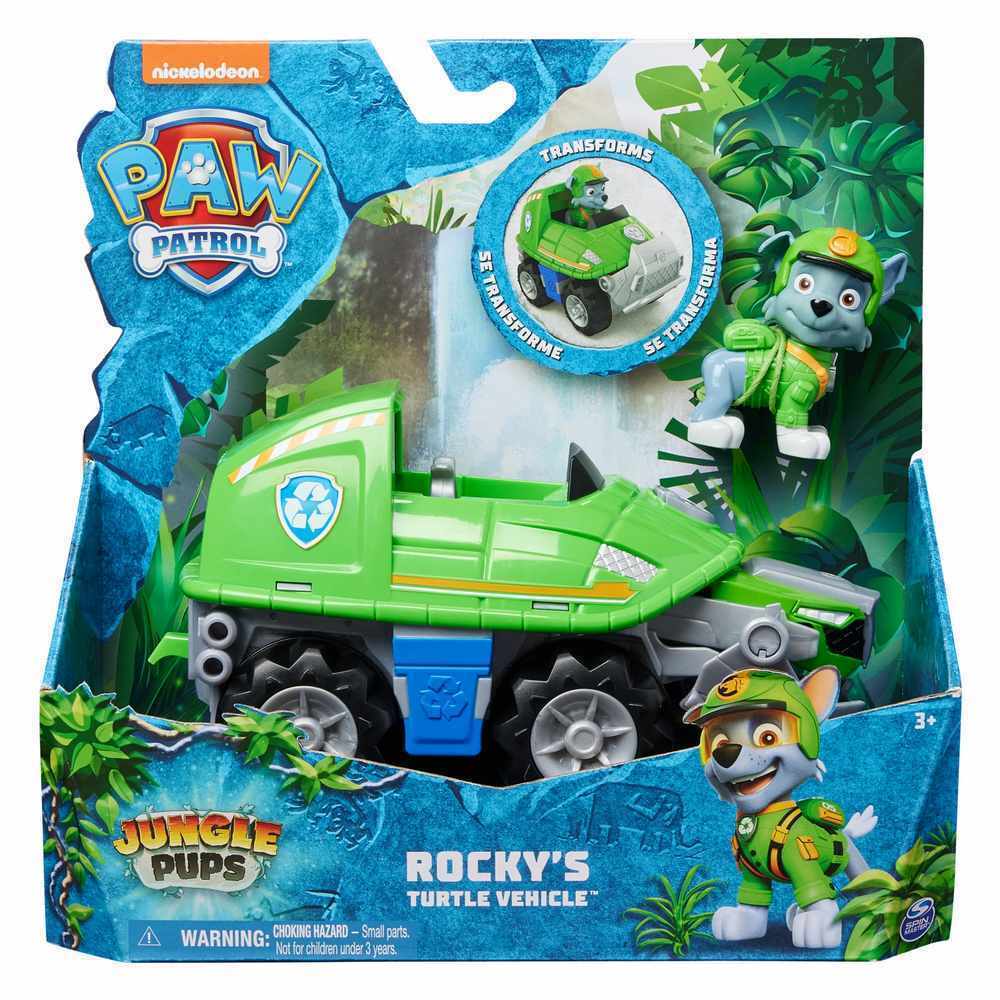 Rocky's Turtle Vehicle from Paw Patrol features a green, turtle-shaped design with wheels, accompanied by a small grey pup figure wearing a green outfit and hat.