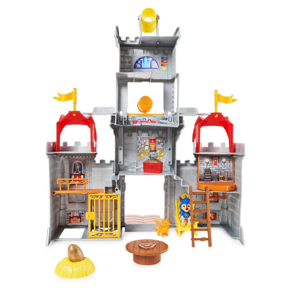Colorful Paw Patrol Rescue Knights Playset featuring a gray castle with red flags, a spinning wheel, a ladder, and various accessories including a lion figure and a golden egg.