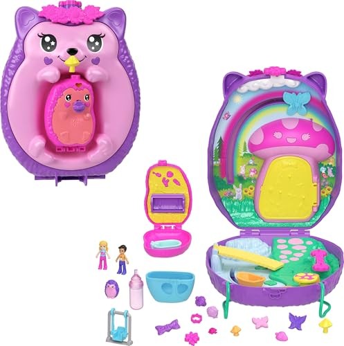 Bright pink hedgehog-shaped compact playset with a purple lid, featuring a rainbow, mushroom door, and miniature figures, including a mom and baby, along with accessories like a bottle and swing.