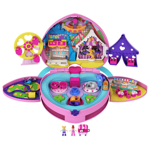 Bright pink and purple Polly Pocket playset shaped like a backpack, featuring a fairground scene with a ferris wheel, pool, and various tiny accessories and figures.