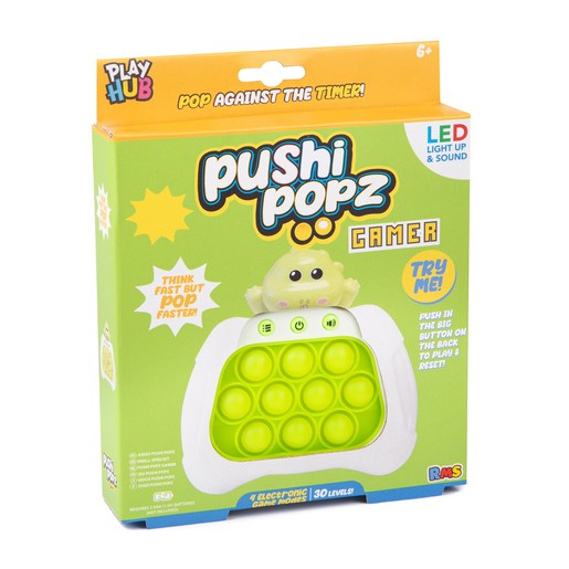 Bright green box featuring a dinosaur character, labeled "Pushi Popz Gamer," with LED lights, sound features, and a pop bubble game layout, suitable for ages 6 and up.