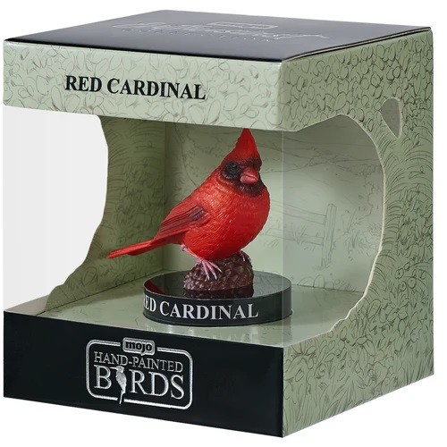 Bright red hand-painted cardinal figurine perched on a brown base, displayed in a clear box with a green and black design, labeled "Red Cardinal" and "Hand-Painted Birds."