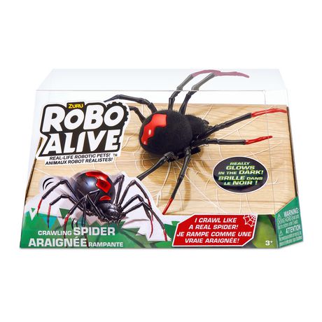Realistic black robotic spider with red accents, designed to crawl and glow in the dark, displayed in a clear plastic packaging with a cardboard base.