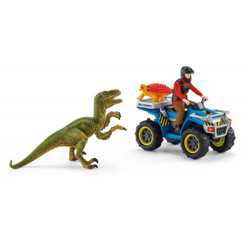 A green Velociraptor figure stands beside a blue quad bike with a rider wearing a helmet, featuring a yellow dinosaur on the back and rugged black wheels.