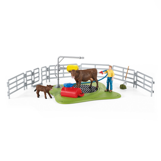 Colorful playset featuring a brown cow and calf, a farmer figure, a wash area with a red tub, and a fenced grassy area, made of durable plastic.