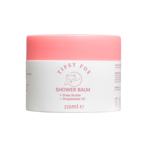 Tipsy Fox 220ml shower balm in a white container with a pink lid, featuring text highlighting shea butter and grapeseed oil as key ingredients.