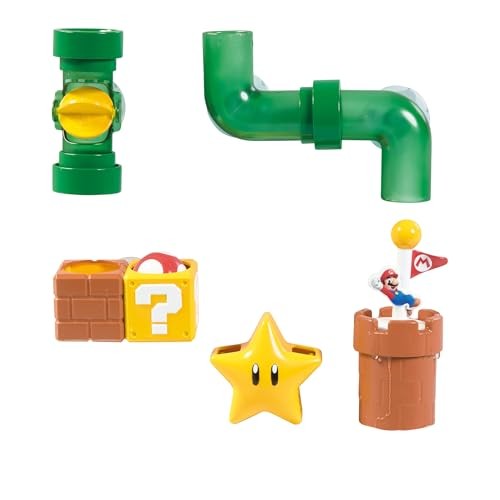 Colorful bath toy set featuring green plastic pipes, a yellow ball, a star, a question block, and a Mario figure atop a brown castle, designed for interactive play.