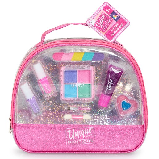Clear makeup bag with a pink glitter base, featuring colorful makeup items including nail polish, lip gloss, and a compact with pastel shades.