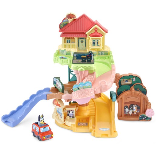 Colorful playset featuring a multi-level house with a red roof, slide, and a blue car, designed for interactive play with Bluey characters and accessories.
