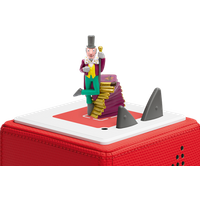 "Colorful Charlie and the Chocolate Factory Tonie figure with top hat, standing on gold bars atop a red Toniebox."