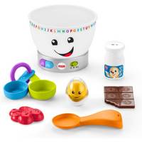 Fisher Price mixing bowl with smiley face, colorful buttons, measuring cups, egg, milk bottle, chocolate, and spoon.