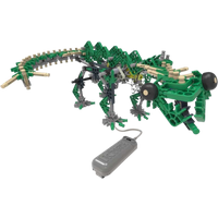 K'Nex dinosaur building set with green and beige pieces, articulated limbs, and a remote control.