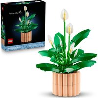 LEGO Botanicals Peace Lily with green leaves, white blooms, and tan pot, box in background.