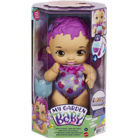 "My Garden Baby doll with purple hair, butterfly wings, and berry-themed outfit in colorful packaging"