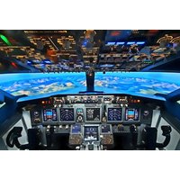 Flight simulator cockpit with illuminated control panels and panoramic screen showing aerial landscape.