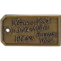 Bronze rectangular pin badge with "Please look after this bear. Thank you." engraved in playful font.