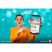 Woman in orange suit holding smartphone displaying Slingo game with 250 Starburst slot spins on blue bokeh background.