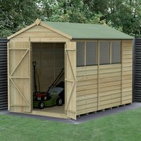 Wooden shed with green roof, double doors, shiplap panels, and windows; lawnmower visible inside.