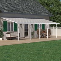 White Palram Canopia Sierra patio cover with clear roof panels and white frame attached to a house.
