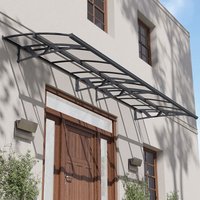 Grey metal and clear panel door canopy with arched design and wall-mounted brackets, covering a large entrance.