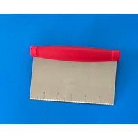 Stainless steel chopper scraper with red handle and measurement markings on blade.