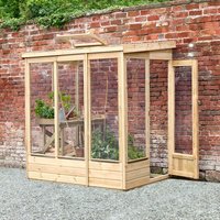 Wooden lean-to greenhouse with clear panels, open back, and door, set against a brick wall.