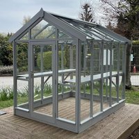 Greenhouse with apex roof, painted wooden frame, clear glass panels, and double doors, measuring 4'4 x 4'9.