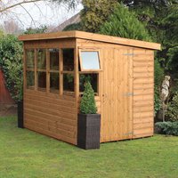 Wooden garden shed with shiplap siding, pent roof, multiple windows, and a small door, measuring 6' x 6'.