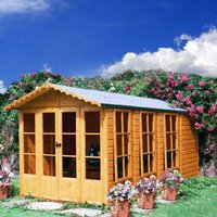 Wooden Shire Westminster summer house with large windows, double doors, and pitched roof, surrounded by flowers.