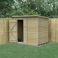 Wooden windowless shed, 7'x5', overlap pressure-treated panels, single door, flat roof, set on grass with fence backdrop.
