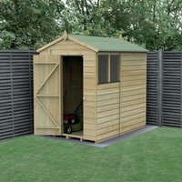 Wooden apex shed with shiplap cladding, green roof, single door, and window, set in a garden with fence backdrop.