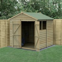 Wooden shed with green apex roof, double doors, side window, and overlap cladding, set in a grassy garden area.