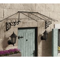 Black metal and clear polycarbonate door canopy with ornate side brackets over a wooden door on a stone wall.