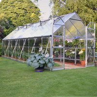 Silver Palram Canopia Balance greenhouse, 8' x 20', with clear panels and sturdy frame, set in a grassy garden.