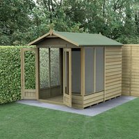 Wooden apex summer house with double doors, five windows, and green roof, set against a hedge and fence backdrop.