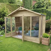 Wooden summer house with apex roof, double doors, and four windows, set in a garden with greenery.