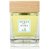 Acqua dell'Elba diffuser with light wood cap, square glass bottle, and yellow liquid, labeled "Isola di Montecristo."