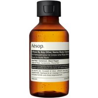 Amber Aesop body cleanser bottle with black cap and white label, 100 ml size.