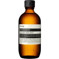 Amber glass bottle of Aesop B & Tea Balancing Toner with black cap and minimalist white label.