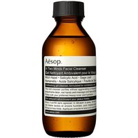 Amber bottle of Aesop In Two Minds Facial Cleanser, black cap, white label with black text, 100ml.