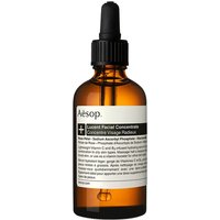 Amber glass bottle with black dropper cap, labeled "Aesop Lucent Facial Concentrate 60 ml" in black and white text.