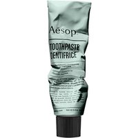 Aesop toothpaste in a crumpled metallic tube with black cap and minimalist black text design.