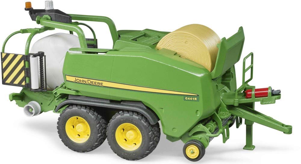 Green Bruder 1:16 scale John Deere C441R wrapping chamber baler with yellow rolls, detailed wheels, and a rear discharge chute, showcasing realistic design and features.