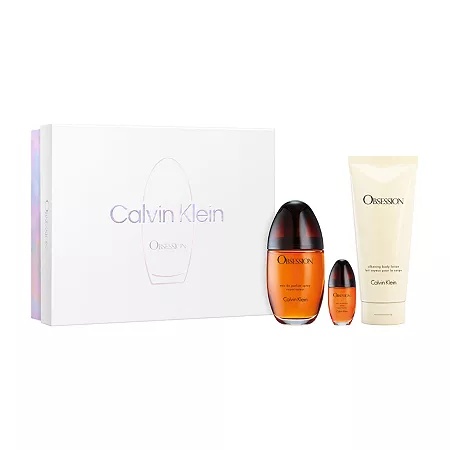 Calvin Klein Obsession gift set featuring a 100 ml EDP in a dark amber bottle, a 200 ml body lotion in a cream tube, and a 100 ml mini perfume, all presented in a sleek white box.