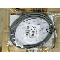 Gray Datalogic EAS Cable coiled in clear packaging with barcode label and connectors visible.