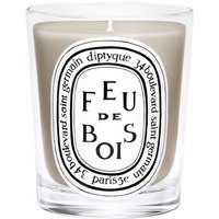 Diptyque Feu de Bois candle in clear glass jar with black and white label, 190g woody scent.